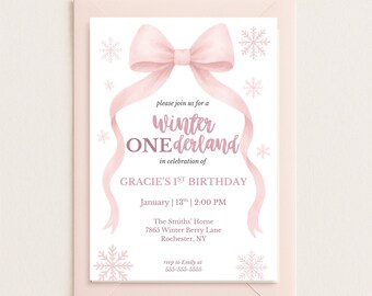 May include: A pink invitation card with a bow and snowflakes, announcing a "Winter ONEderland" first birthday party. The card includes the date, time, and location: January 13th at 2:00 PM, The Smiths' Home, Rochester, NY. RSVP information is also provided.