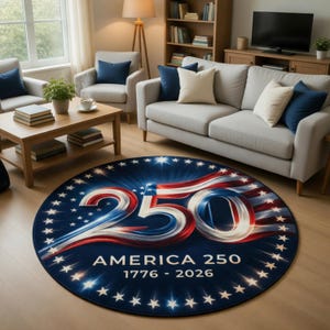 May include: A round rug with a patriotic design. The rug features the number "250" in red, white, and blue, with the text "AMERICA 250 1776 - 2026" in white. The rug is surrounded by white stars on a dark blue background.