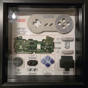 Caja de sombras con desmontaje del mando de SNES - Decoración de pared enmarcada