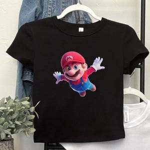 May include: A set of three ceramic mugs with a speckled, matte finish. The mugs are in shades of cream, light gray, and dark gray. Each mug has a simple, minimalist design, perfect for coffee or tea.