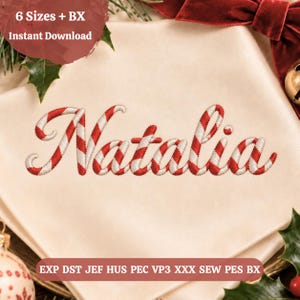 May include: An embroidery design featuring the name Natalia in a candy cane striped pattern of red and white. The text 6 Sizes + BX Instant Download and EXP DST JEF HUS PEC VP3 XXX SEW PES BX are visible on the cream fabric background.
