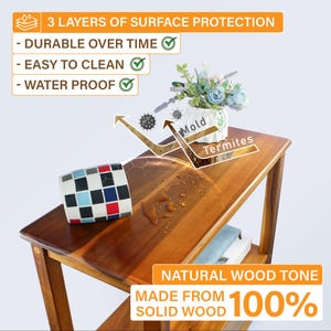 May include: A wooden side table with a natural wood tone, featuring three layers of surface protection. The table is made from solid wood and is water proof. A mug with a checkered pattern sits on the top shelf.