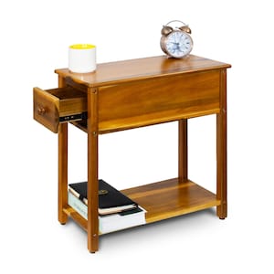 May include: A wooden nightstand with a drawer and a lower shelf. A white mug with a yellow interior, a small alarm clock, and books are on the nightstand. The nightstand is approximately 24 inches tall, 18 inches wide, and 12 inches deep.