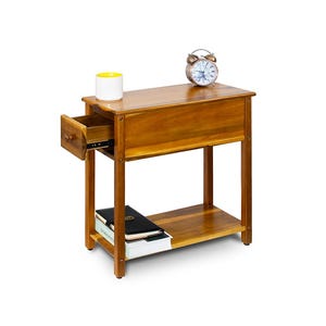 May include: A rectangular wooden side table with a warm brown finish, featuring a single pull-out drawer on the left side, a flat top surface, and a lower shelf. A white cup, a silver alarm clock, and a black notebook are placed on the table.
