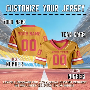 May include: Mustard yellow jersey with red trim, displaying the text "CUSTOMIZE YOUR JERSEY". The front and back of the jersey are visible, with the number "00" and spaces for "YOUR NAME" and "TEAM NAME".
