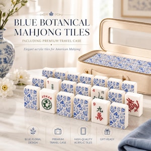 May include: A set of white acrylic Mahjong tiles featuring blue botanical floral patterns, some with red and green character markings including the word JOKER, displayed alongside a beige zippered travel case with a clear window top.