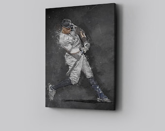 May include: A framed canvas print featuring a stylized illustration of a baseball player in a batting stance. The player is wearing a white and navy uniform with the text "NEW YORK" visible. The background is a dark, textured gray.
