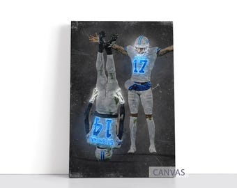 May include: Canvas print featuring two football players in white and blue uniforms. One player is upside down, with the number 14 and the name "ST BROWN" visible. The other player has the number 17. The background is a dark, textured gray.