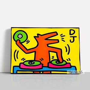 May include: A vibrant pop art canvas print featuring an orange figure with a dog-like head, positioned behind two turntables. The figure is holding a green record. The word "DJ" is written in black. The background is yellow.