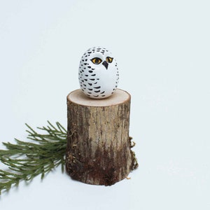 Snowy Owl and tree stump image 2