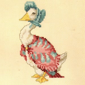May include: Cross-stitch design of a duck wearing a blue bonnet and a red and blue patterned shawl. The duck has a yellow beak and feet, and the background is a light beige color. The cross-stitch is detailed and colorful.