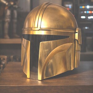 May include: A gold-colored helmet with a black visor, resting on a wooden surface. The helmet has a smooth, metallic finish and is designed with angular shapes. The text "Statement Collector Piece" is displayed at the bottom.