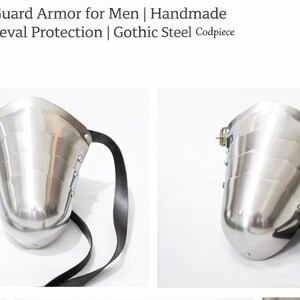 May include: A polished steel groin guard with a curved design, featuring a black leather strap for secure wear. The armor is designed for medieval combat and protection.