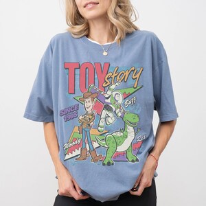 May include: A set of three ceramic mugs with a speckled, matte finish in cream, light grey, and dark grey. Each mug has a simple, minimalist design, suitable for coffee or tea.