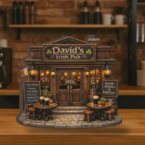 May include: A detailed miniature of "David's Irish Pub" with a wooden facade, lit windows, and an "OPEN" sign. The sign above reads "David's Irish Pub" with shamrocks. Tables with stools, barrels, and an Irish flag complete the scene.