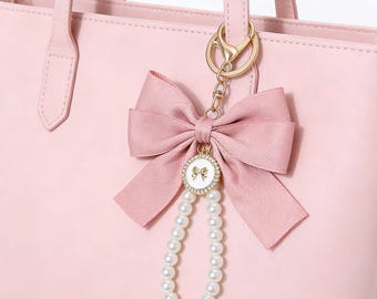 Elegante llavero con lazo de perla para mujer, bonito colgante para bolso, correa para teléfono, 6 colores disponibles, regalo para ella, adorno para espejo de coche.