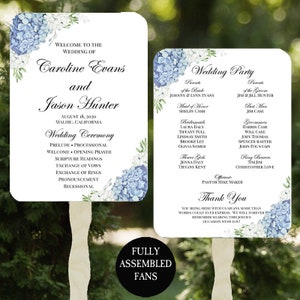 May include: Two wedding ceremony fans with blue and white hydrangea floral designs. The left fan lists the wedding ceremony order. The right fan lists the wedding party members. The text on the fans reads "Welcome to the wedding of Caroline Evans and Jason Hunter, August 18, 2020, Malibu, California".