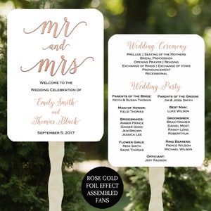 May include: Wedding ceremony and reception signage with rose gold foil lettering. The signs include the names Emily Smith and Thomas Black, the wedding date, and a list of wedding party members.