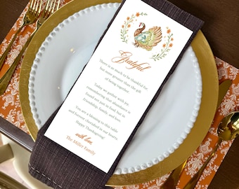 May include: A rectangular white paper card featuring a watercolor turkey illustration, orange floral wreath, and the text Grateful, There is so much to be thankful for, Today we gather with joy, You are a blessing to this table, and The Miller Family.