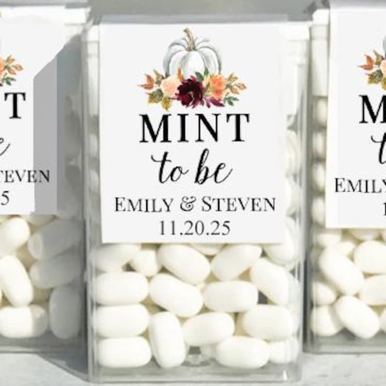 May include: Clear plastic boxes filled with white mints, each labeled with a white square featuring a pumpkin and floral arrangement. The text reads "MINT to be" with names and a date.