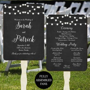 May include: Black and white wedding ceremony and reception program fans with string lights and chalkboard background. The fans feature the names Sarah and Patrick, the wedding date, and the wedding party details.