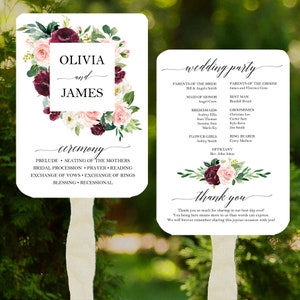 May include: Wedding ceremony program fan with a floral design in shades of pink, burgundy, and green. The fan features the names Olivia and James, the wedding party, and the ceremony order. The text "thank you" is printed at the bottom.