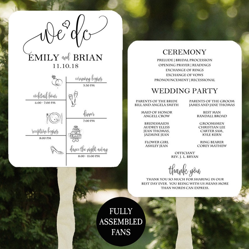 May include: A white wedding sign with black text and illustrations. The sign includes the couple's names, Emily and Brian, the wedding date, 11.10.18, and a schedule of events for the wedding day. The events include a cocktail hour, ceremony, dinner, and dancing. The sign also includes a list of the wedding party members and their roles.