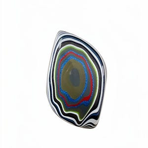 May include: An irregular, rounded ring featuring a layered, multi-colored pattern of black, white, green, red, and blue bands. The center of the ring displays a smooth, solid grey oval shape surrounded by concentric, wavy, and vibrant colored stripes.