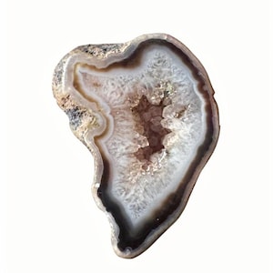 May include: A polished, heart-shaped geode with a white, crystalline interior. The outer edge features bands of brown, tan, and gray, creating a natural, earthy aesthetic. The geode is set against a plain white background.