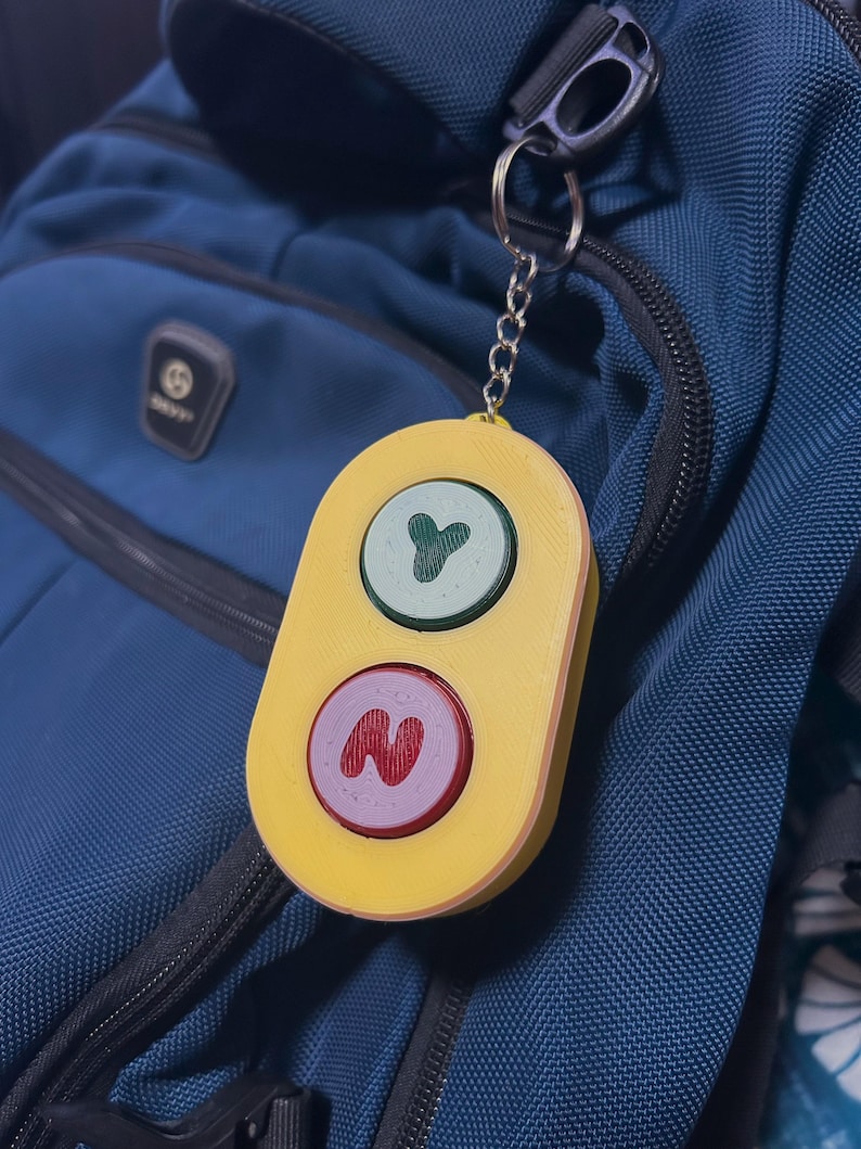 Bluey toy hanging from a backpack.