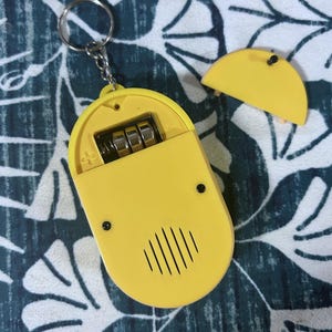 Bluey Toy - back of the toy with three button batteries inside that battery compartment.