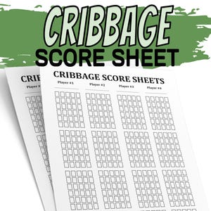 May include: Two white cribbage score sheets with black text. The top sheet reads "CRIBBAGE SCORE SHEET" in large letters. Below, the text reads "CRIBBAGE SCORE SHEETS" with spaces for four players. Each sheet has rows of small boxes.