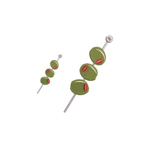 May include: Embroidered design of green olives with red pimentos on a silver skewer. The olives are oval-shaped and have a textured appearance. The design is set against a white background.