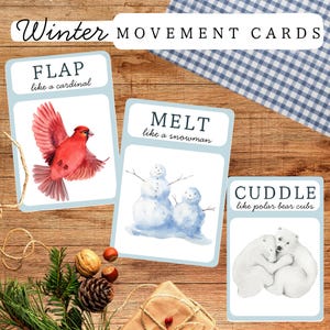 May include: Winter Movement Cards featuring watercolor illustrations. One card shows a red cardinal with the word "FLAP". Another card depicts two snowmen with the word "MELT". The third card shows two polar bears with the word "CUDDLE".