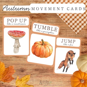 May include: Set of three autumn-themed movement cards. Each card features a watercolor illustration and a prompt: "Pop Up like a mushroom," "Tumble like a pumpkin," and "Jump like a fox." The cards are on a wooden surface.