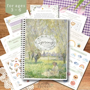 Op de afbeelding: Een spiraalgebonden activiteitenboek met een lentethema op de omslag, met een schilderij in Monet-stijl. Het boek bevat pagina's met de tekst "Spring Morning Menu", "My morning tasks" en "I Spy - Spring".