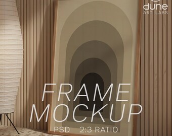 May include: A framed art print mockup featuring a neutral color palette of beige and brown arches. The wooden frame is leaning against a light wood-paneled wall. The text "FRAME MOCKUP" is displayed on the print, along with "PSD 2:3 RATIO". The Dune Art Labs logo is in the upper right corner.