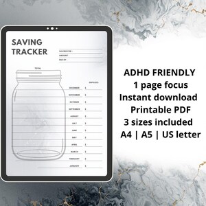 May include: A white ceramic mug with a black handle and the text "But First, Coffee" in a black, handwritten-style font. The mug is on a white surface.