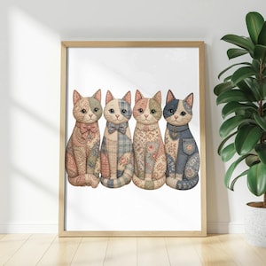 Framed artwork of four fabric cats in various patchwork patterns sitting in a row.