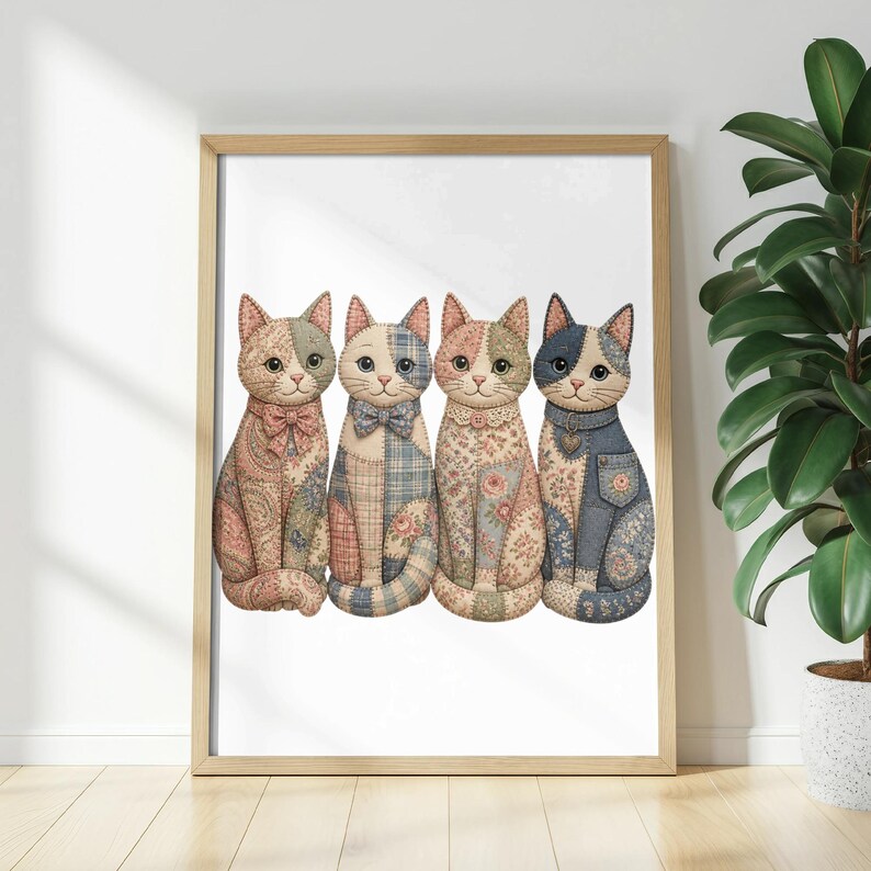 Framed artwork of four fabric cats in various patchwork patterns sitting in a row.