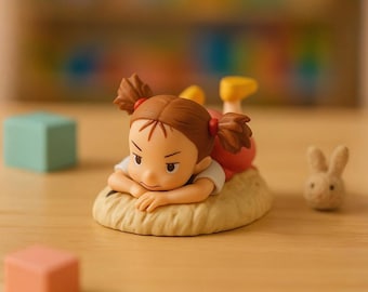 Cute Mei Kusakabe Inspired Mini Figurine Relaxed on the Pad, Handcrafted Small Figure for Nursery and Shelf