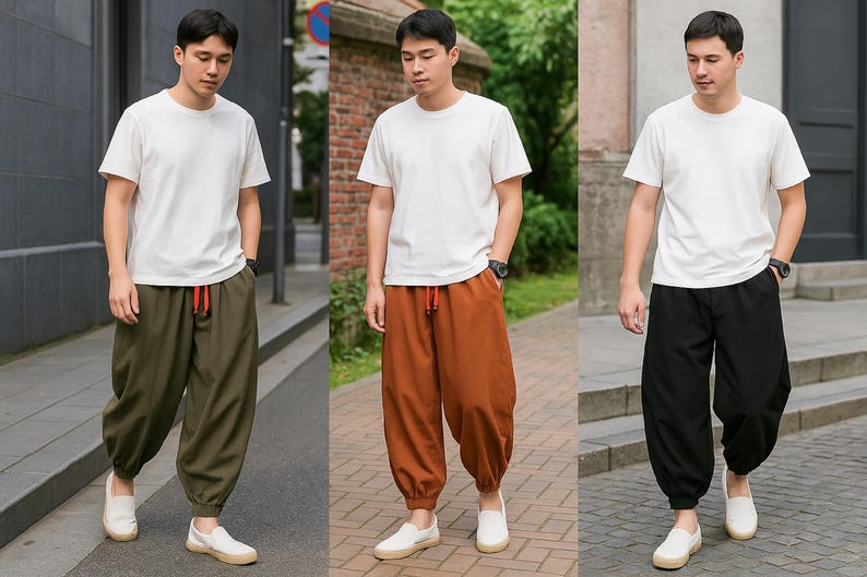May include: Three men wearing white t-shirts and loose-fitting pants in olive green, rust, and black. The pants have a drawstring waist and are paired with white slip-on shoes. The outfits are casual and comfortable.