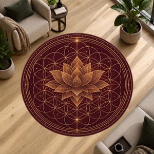 May include: A circular area rug featuring a deep burgundy background with a central gold lotus flower design. The lotus is surrounded by an intricate geometric pattern of overlapping circles and thin lines, accented with small star-like points.