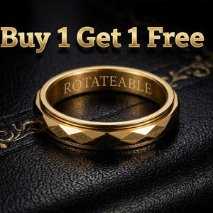 May include: A gold-coloured ring with the word "ROTATEABLE" engraved on the inner band. The ring has a faceted design and is set against a black, textured background. The text "Buy 1 Get 1 Free" is displayed above the ring.