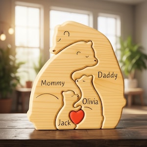 May include: Wooden family bear puzzle with the words "Mommy", "Daddy", "Olivia", and "Jack" engraved. A red heart is in the center. The puzzle is made of light-colored wood and is designed to interlock, creating a family bear shape.