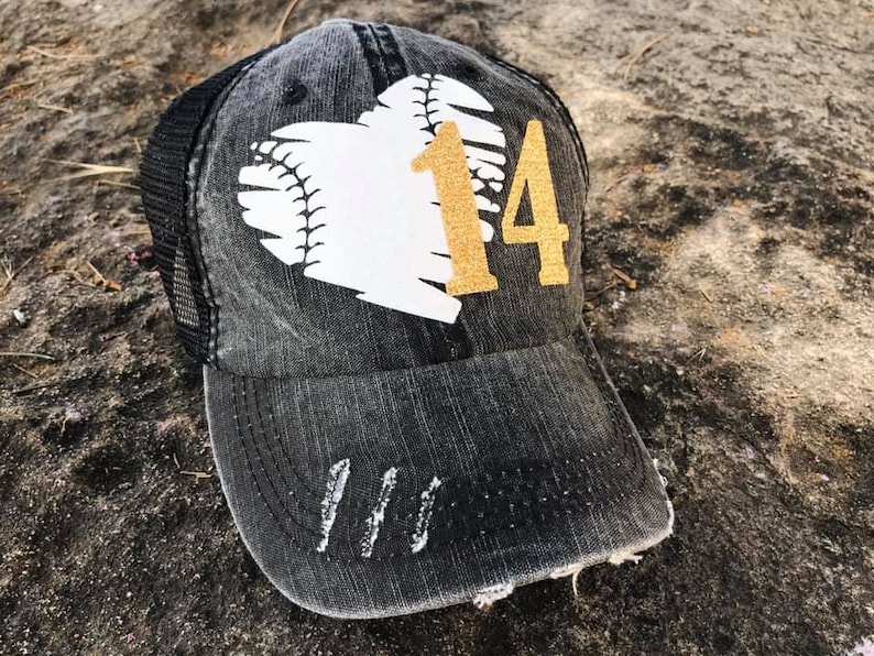 May include: Black and white baseball themed trucker hat with a gold glitter number 14 on a white heart.