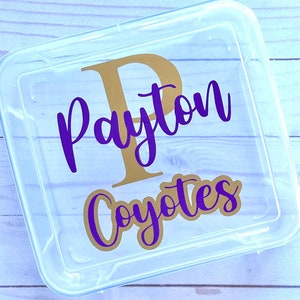 May include: A clear plastic storage box with a gold "P" and the name "Payton Coyotes" written in purple lettering.