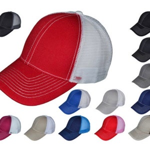 May include: A collection of 15 baseball caps with a variety of colors and mesh back panels. The caps are all the same style, with a curved brim and a structured crown.