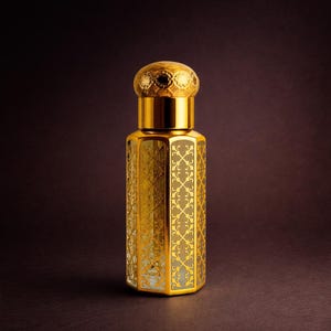 May include: A gold-colored perfume bottle with an ornate, geometric design. The bottle has a hexagonal shape and a decorative cap. The intricate pattern is visible on the bottle's surface, creating a luxurious aesthetic. The background is a dark brown.