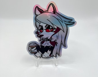 May include: Holographic sticker featuring a cartoon wolf character with red eyes, white and gray hair, and a black outfit. The wolf is holding a coffee cup. The sticker is displayed on a clear stand against a white background.